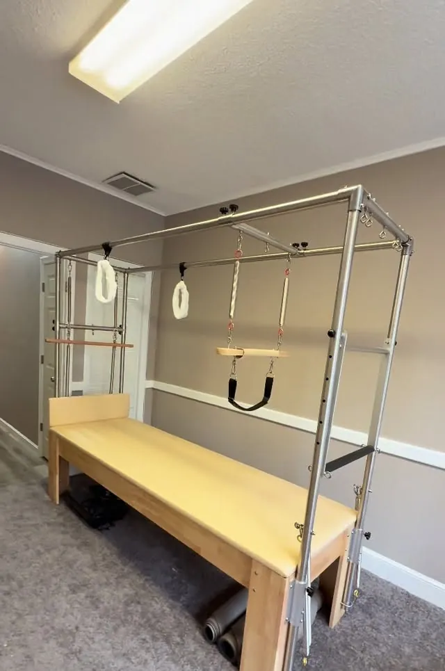 Cadillac trapeze table in a Pilates studio in Lowell, used for supported exercises